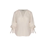 Andres Otalora luxury designer Top with bold silhouette in linen