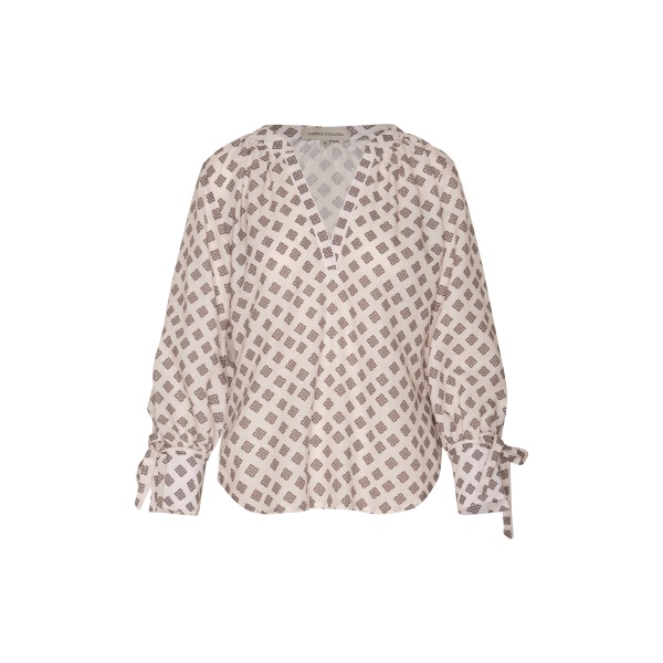 Andres Otalora luxury designer Top with bold silhouette in linen