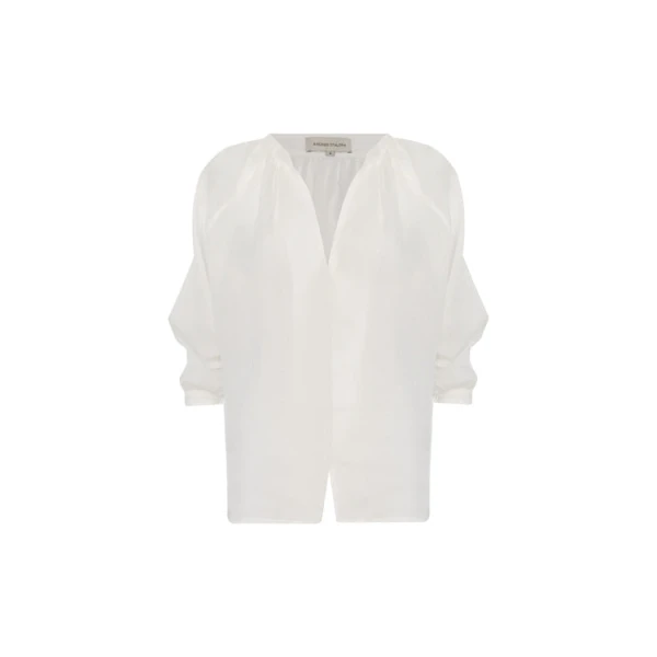 Andres Otalora luxury designer Top with bold silhouette in linen