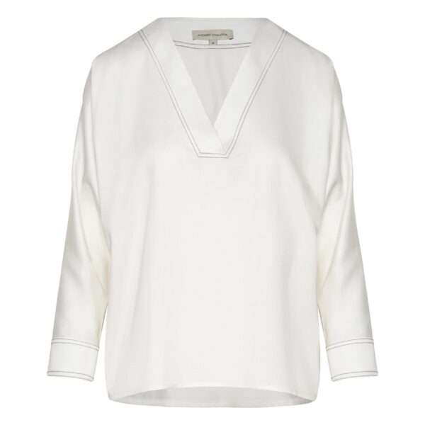 Andres Otalora luxury designer Top with bold silhouette in linen