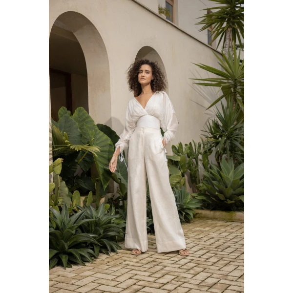 Andres Otalora luxury designer Top with bold silhouette in linen