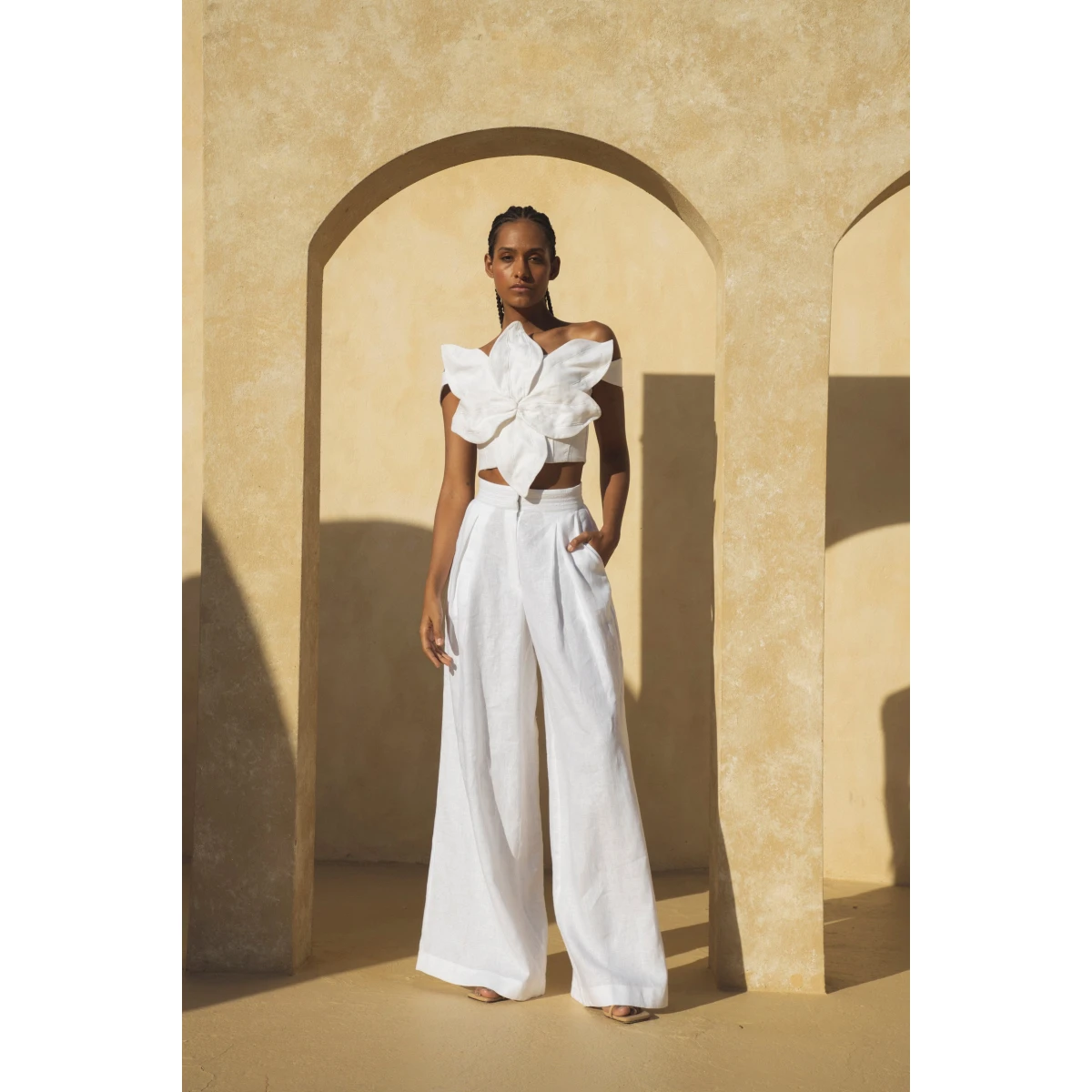 Andres Otalora luxury designer Top with bold silhouette in linen