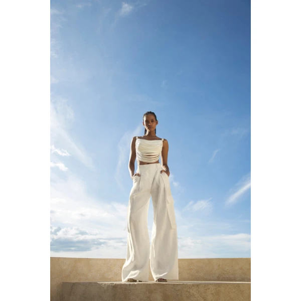 Andres Otalora luxury designer Top with bold silhouette in linen