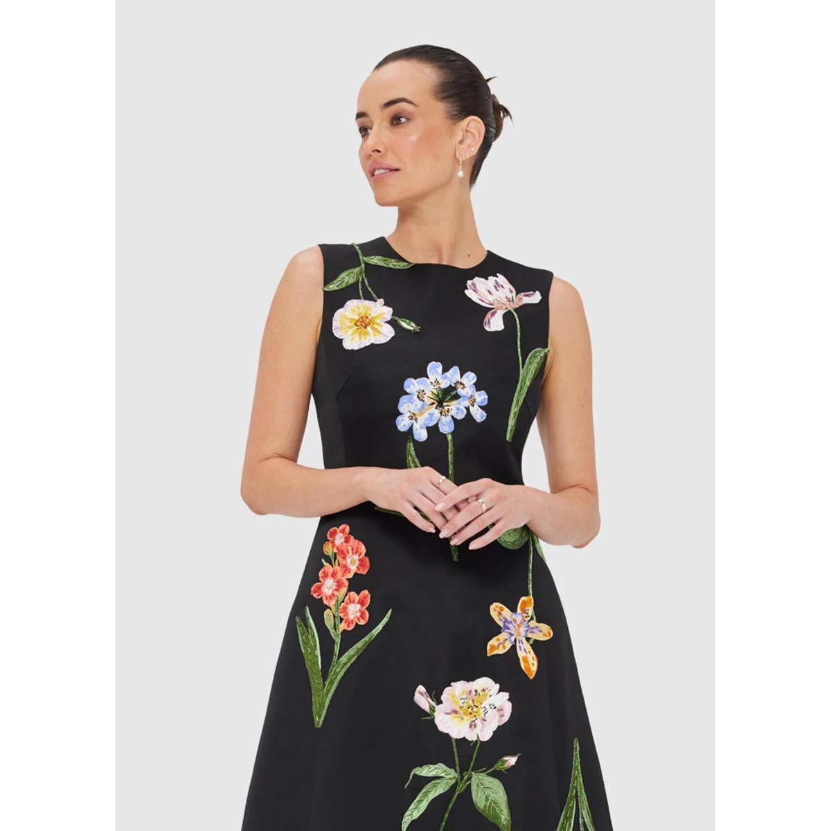 Leo Lin Blue Dresses Step into a midnight garden where vivid wildflowers are scattered across a black canopy. Bright