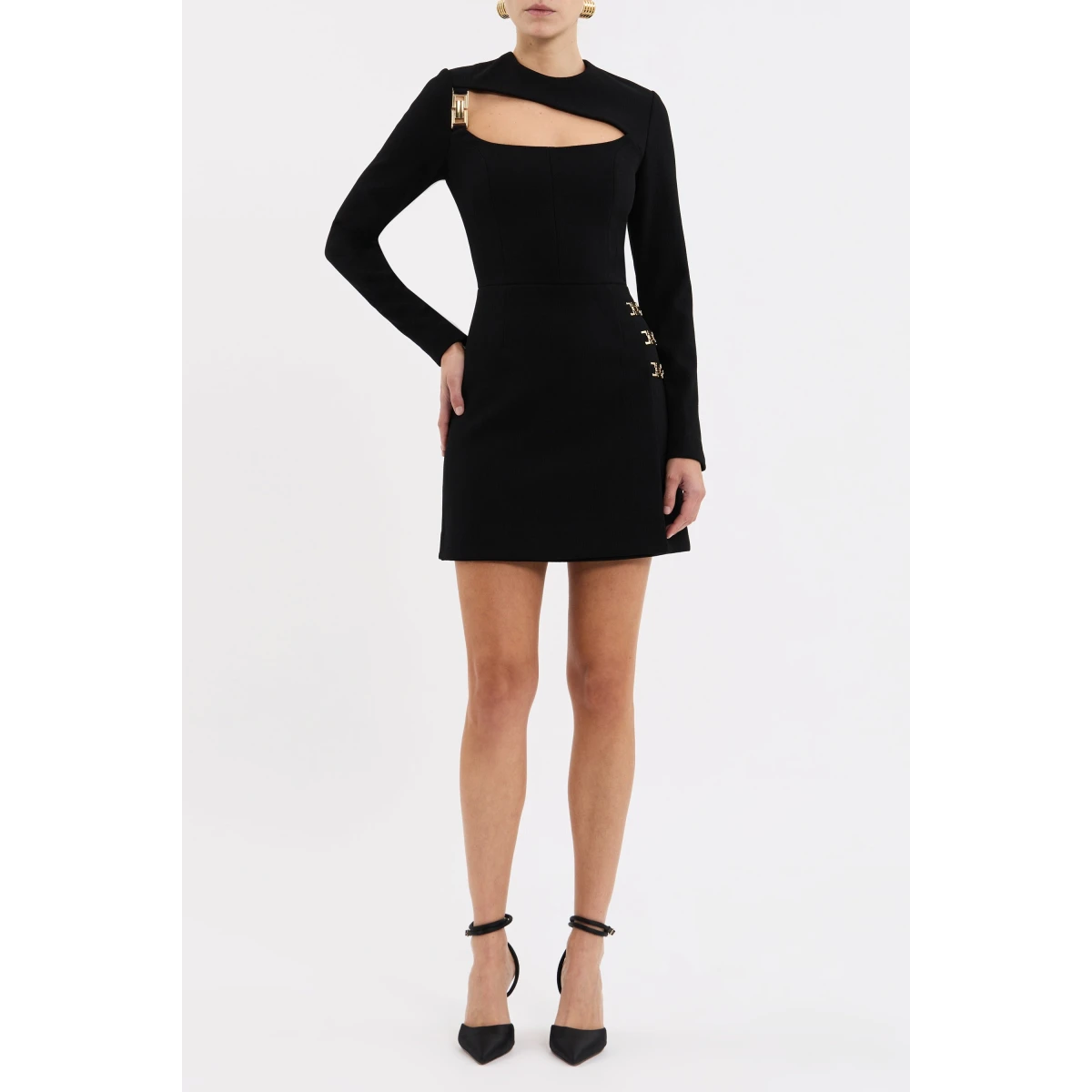its asymmetrical fitted bodice and long sleeves sculpt a flattering silhouette