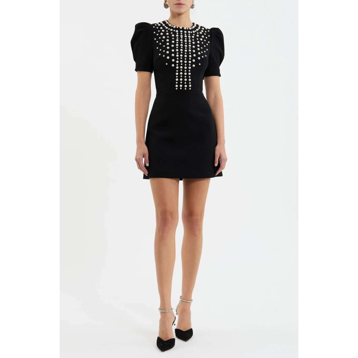 it features short puff sleeves and a rounded neckline that seamlessly complement the fitted bodice