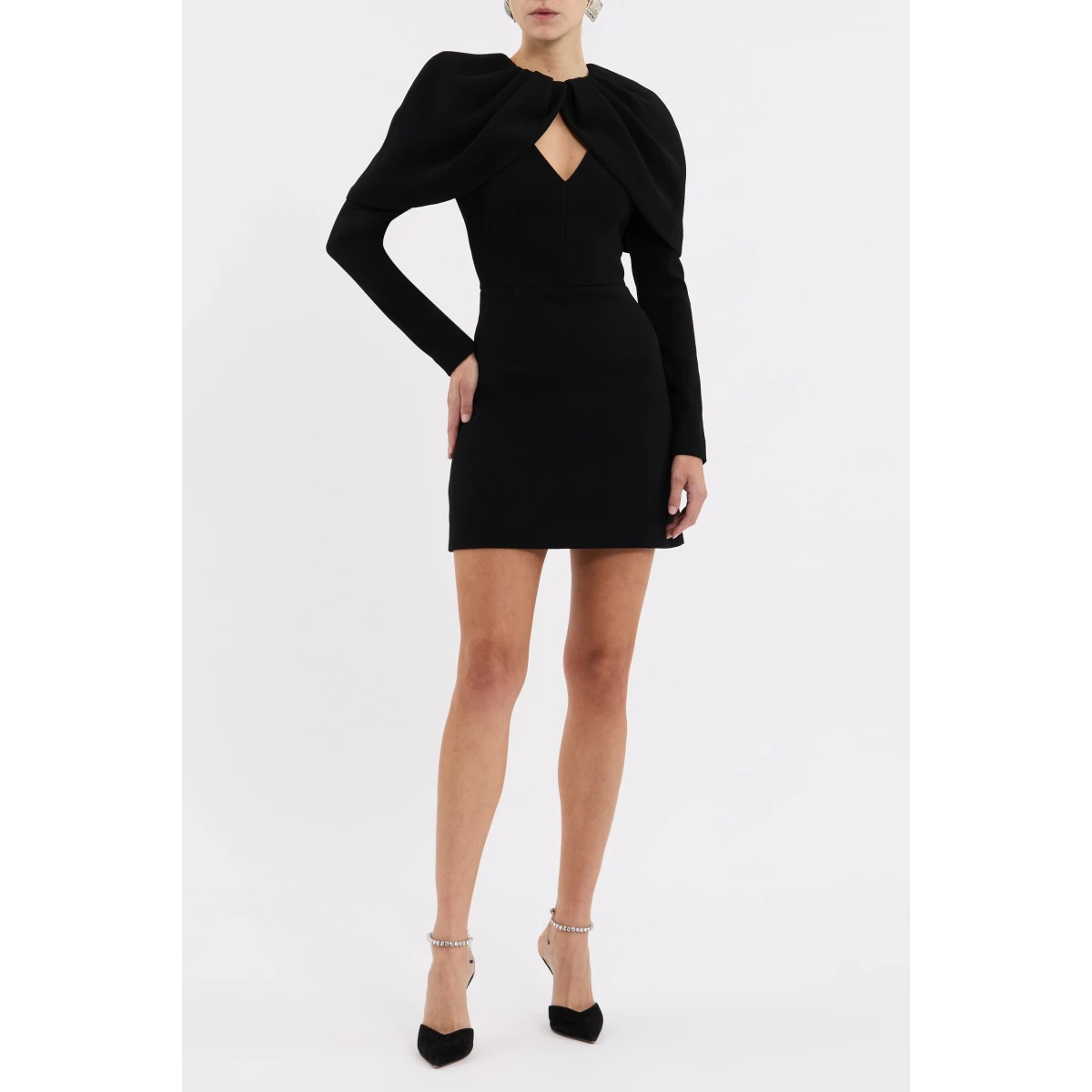 exuding sophisticated elegance. The fitted bodice and mini skirt blend seamlessly to shape a flattering silhouette