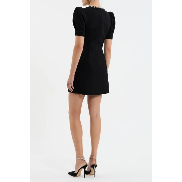 the A-line mini skirt creates a flattering silhouette