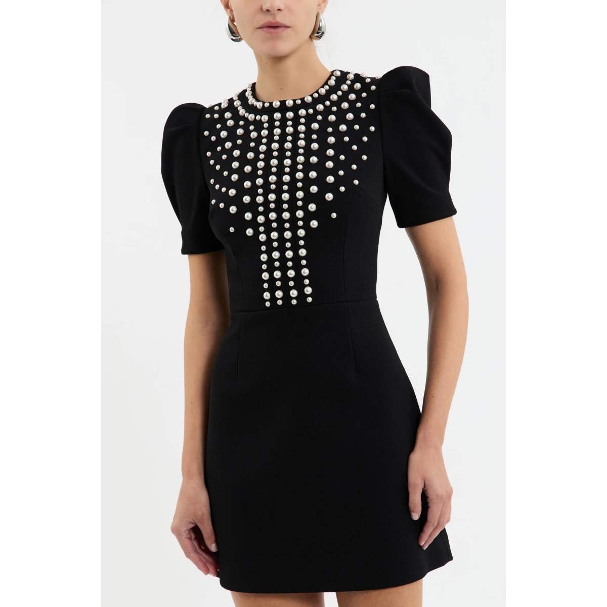 while a zip fastening at the back ensures a seamless fit. Complete with lining