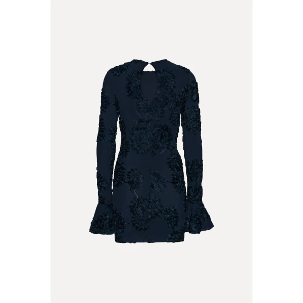 Rotate Blue from Coveti – bold silhouette in vibrant color
