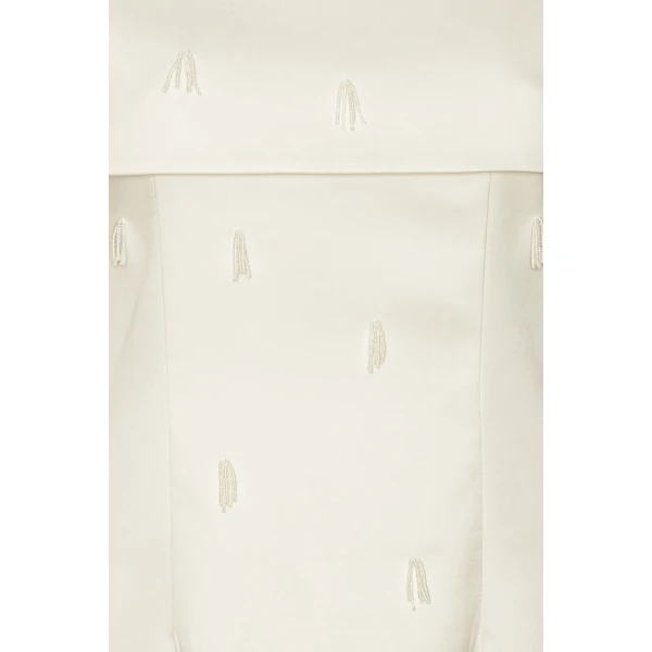 Rotate White from Coveti – bold silhouette in vibrant color