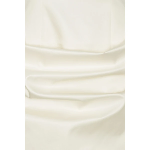 Rotate White from Coveti – bold silhouette in vibrant color