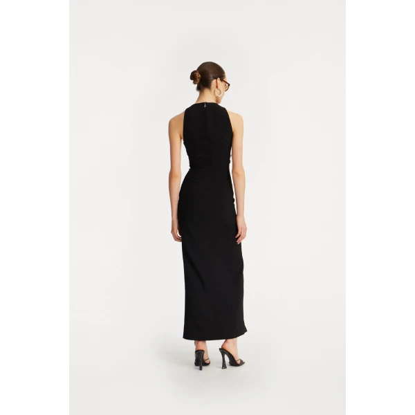 Rotate Black from Coveti – bold silhouette in vibrant color