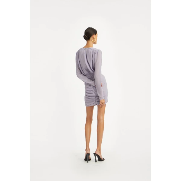 Rotate Purple from Coveti – bold silhouette in vibrant color