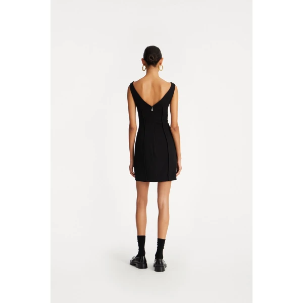 Rotate Black from Coveti – bold silhouette in vibrant color