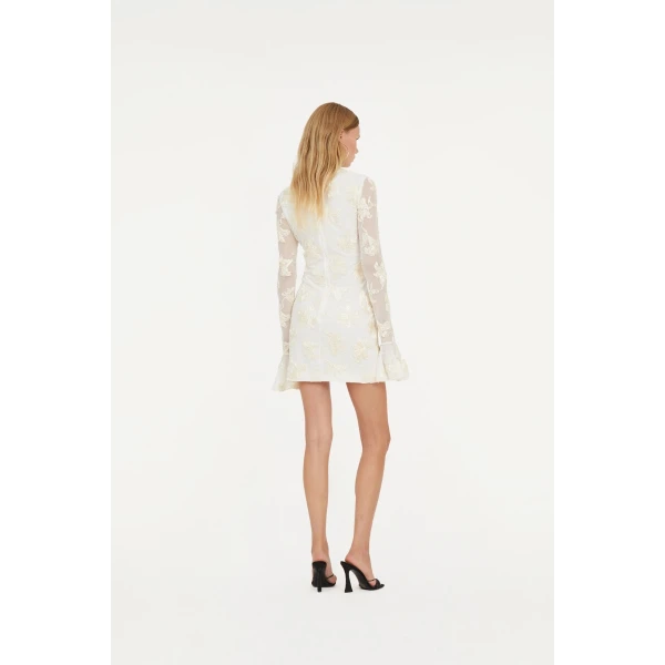 Rotate White from Coveti – bold silhouette in vibrant color