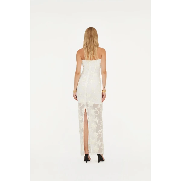 Rotate White from Coveti – bold silhouette in vibrant color