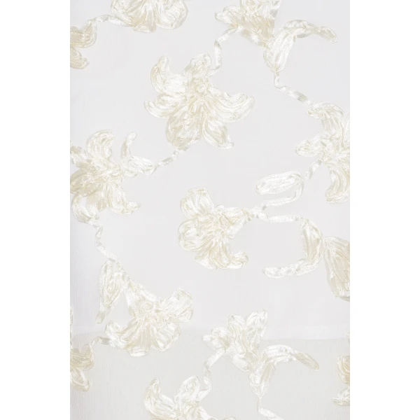 Rotate White from Coveti – bold silhouette in vibrant color