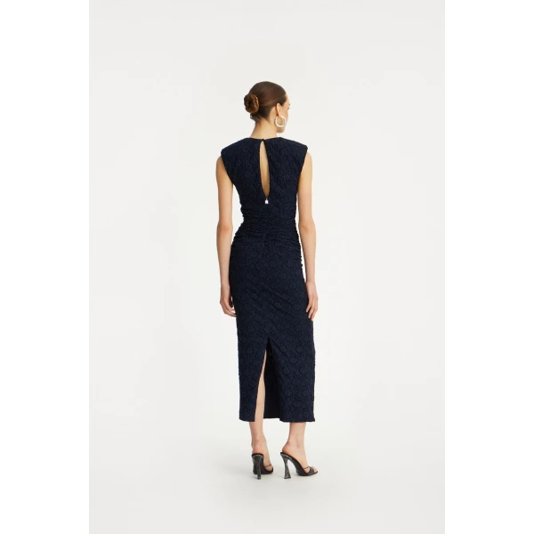 Rotate Blue from Coveti – bold silhouette in vibrant color