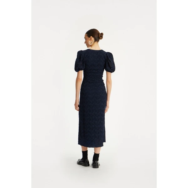 Rotate Blue from Coveti – bold silhouette in vibrant color