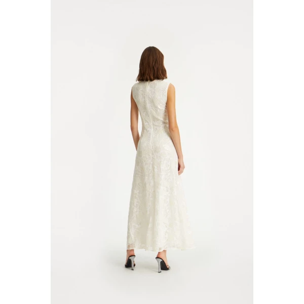 Rotate White from Coveti – bold silhouette in vibrant color