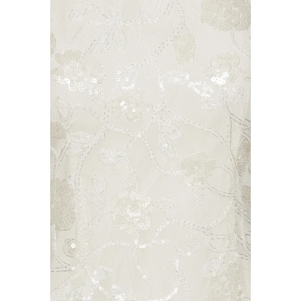 Rotate White from Coveti – bold silhouette in vibrant color