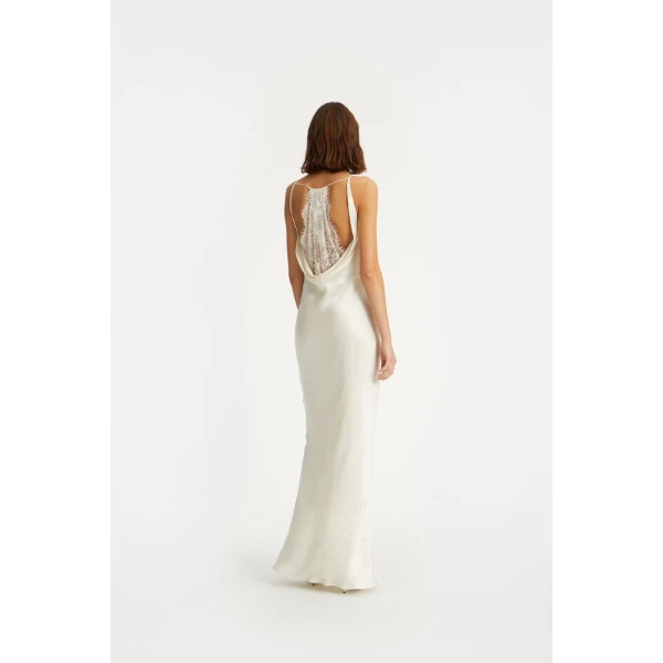 Rotate White from Coveti – bold silhouette in vibrant color
