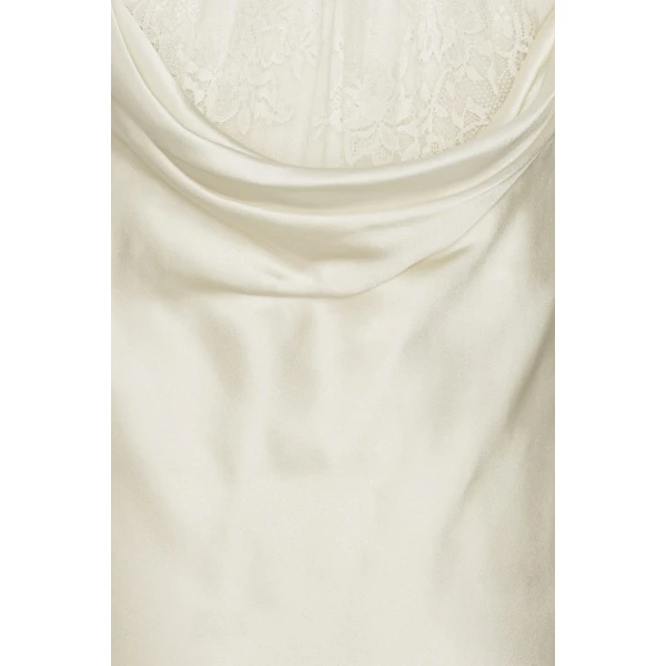 Rotate White from Coveti – bold silhouette in vibrant color