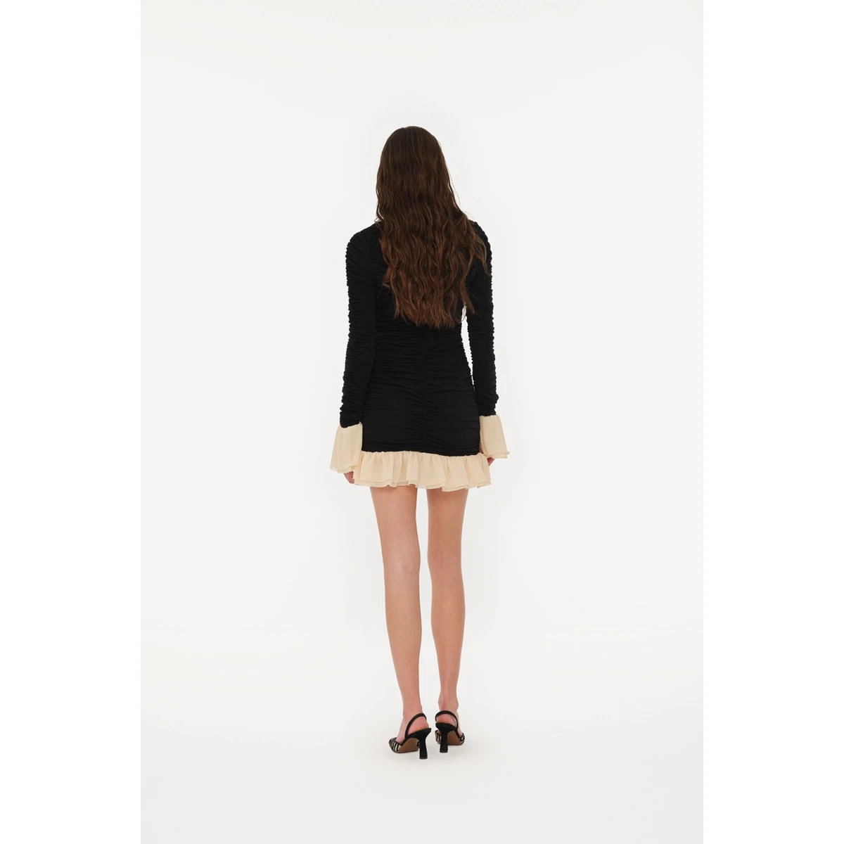 Rotate Black from Coveti – bold silhouette in vibrant color