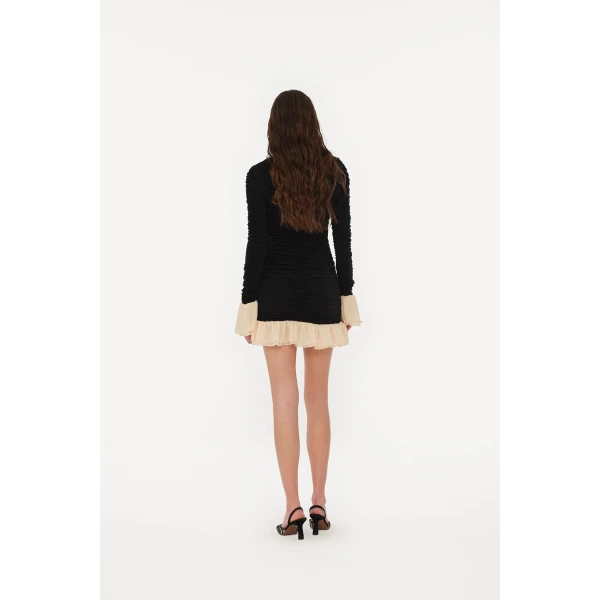 Rotate Black from Coveti – bold silhouette in vibrant color