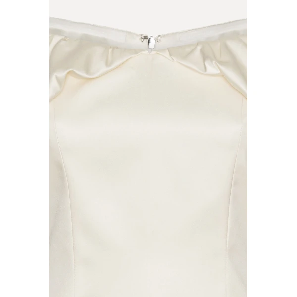 Rotate White from Coveti – bold silhouette in vibrant color