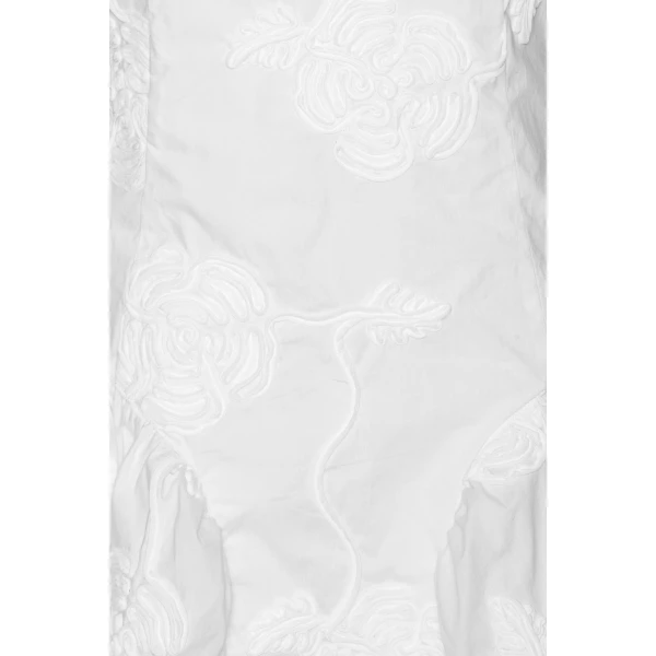 Rotate White from Coveti – bold silhouette in vibrant color