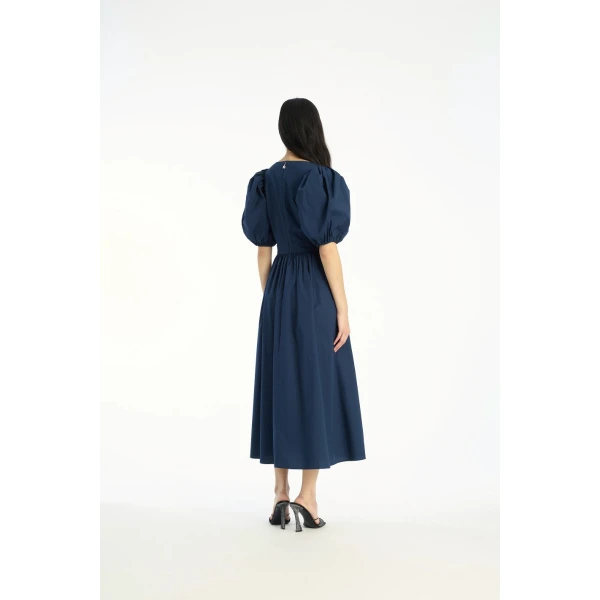 Rotate Blue from Coveti – bold silhouette in vibrant color