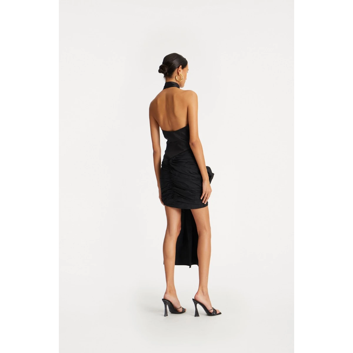 Rotate Black from Coveti – bold silhouette in vibrant color
