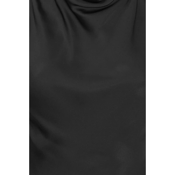 Rotate Black from Coveti – bold silhouette in vibrant color