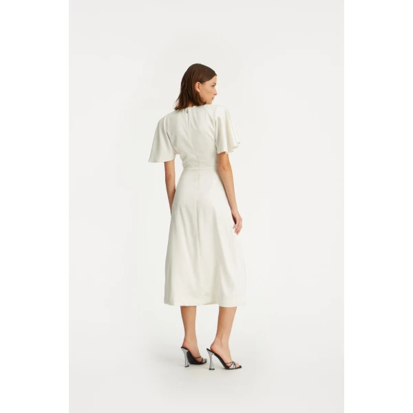Rotate White from Coveti – bold silhouette in vibrant color