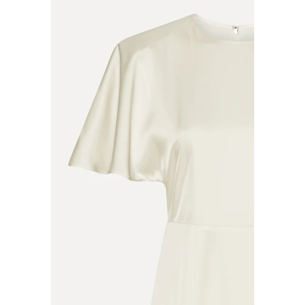 Rotate White from Coveti – bold silhouette in vibrant color