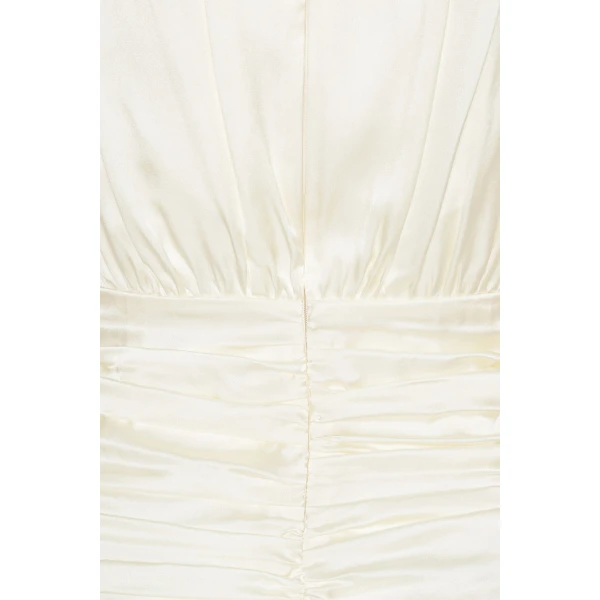 Rotate White from Coveti – bold silhouette in vibrant color