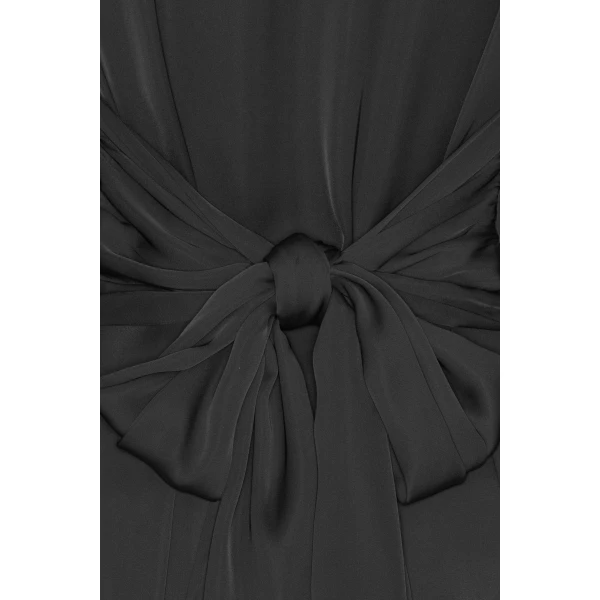 Rotate Black from Coveti – bold silhouette in vibrant color