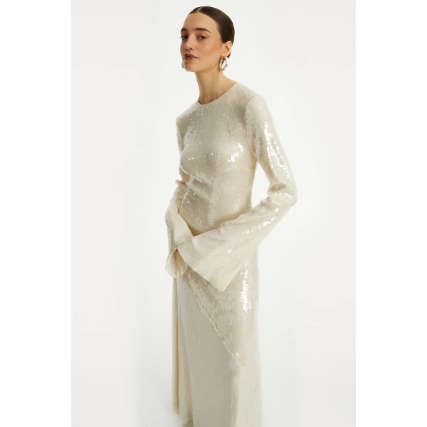 Rotate White from Coveti – bold silhouette in vibrant color