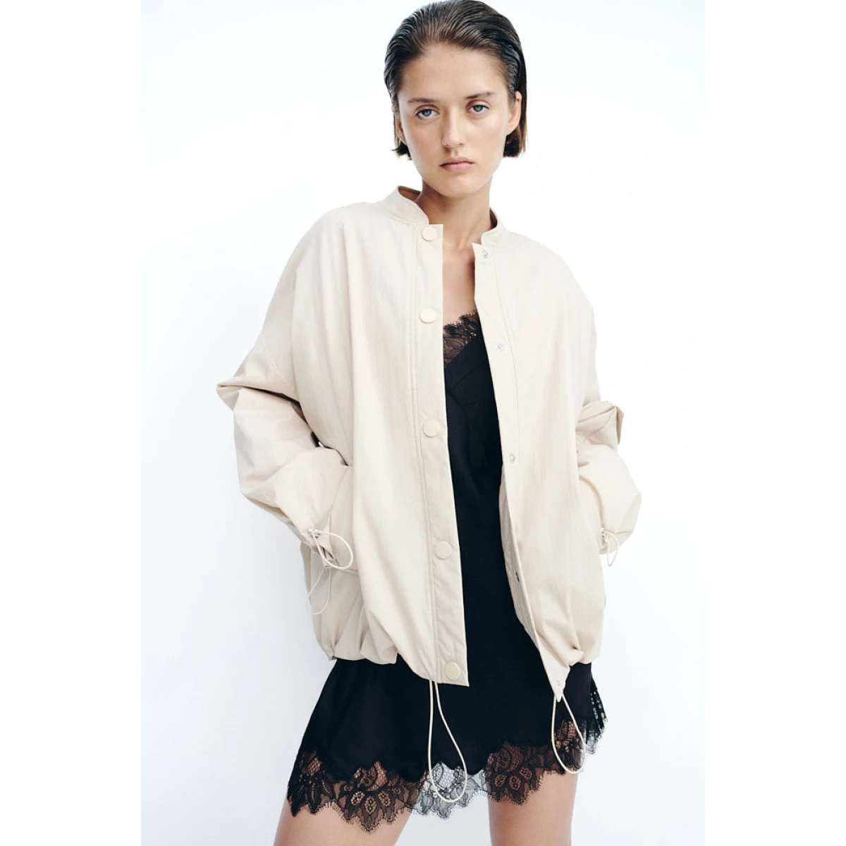 Adjustable elastic at sleeve hem with toggles