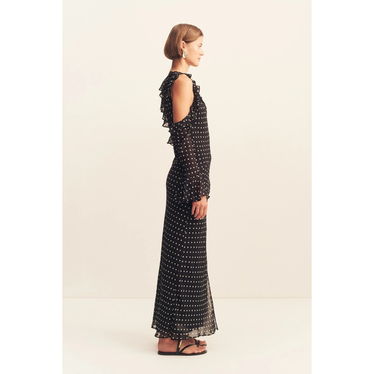 Asymmetrical neckline with ruffles