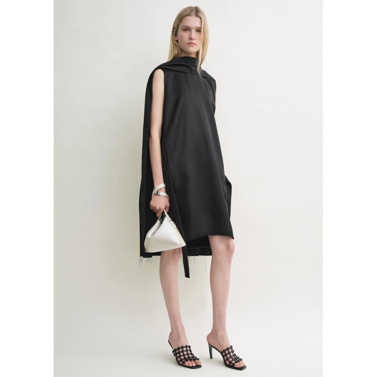 Toteme Dresses with minimalist design at Coveti