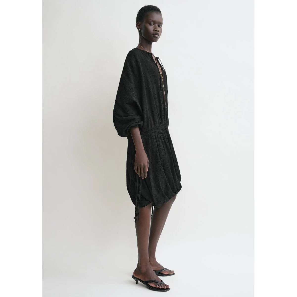 Toteme Dresses with minimalist design at Coveti