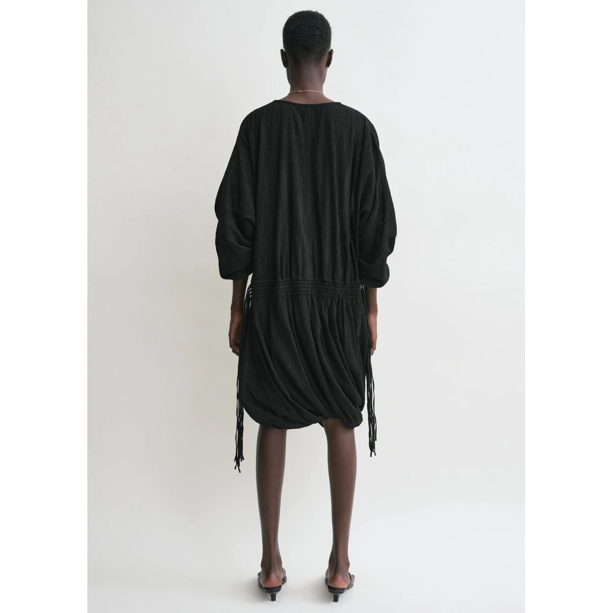 Toteme Dresses with minimalist design at Coveti