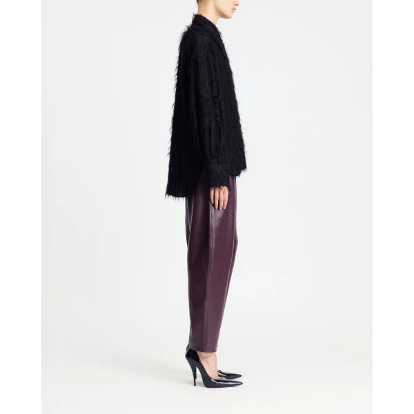 lending a soft tactility to its sharp silhouette.