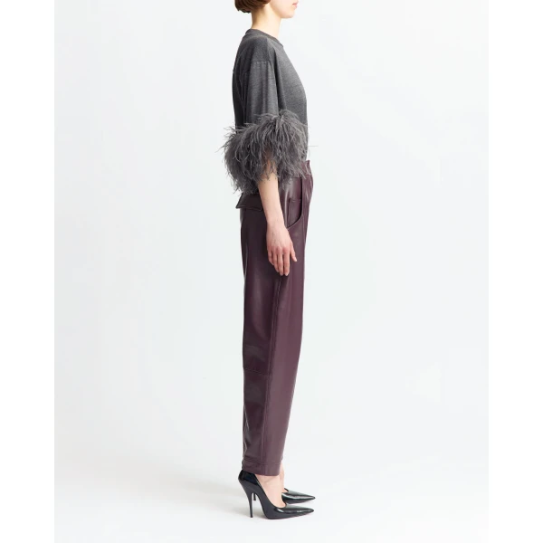 Feathered cuff trims introduce light texture and movement