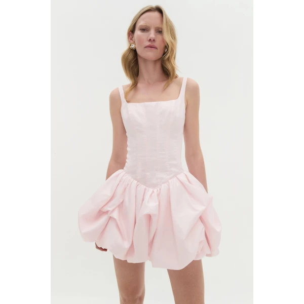 Aje Aus Dresses – structured silhouette with raw femininity from Coveti