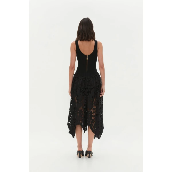 Aje Aus Dresses – structured silhouette with raw femininity from Coveti