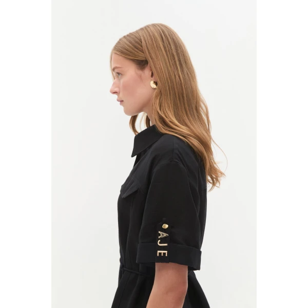 Aje Aus Dresses – structured silhouette with raw femininity from Coveti
